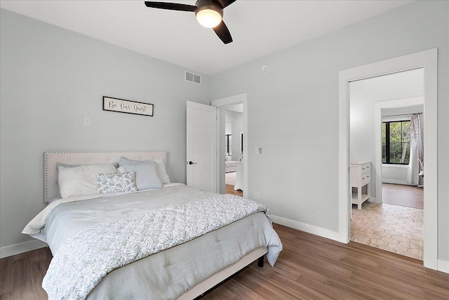 8011 Date Rd, Stevensville, MI 49127 - bedroom featuring wood finished floors, baseboards, and ceiling fan