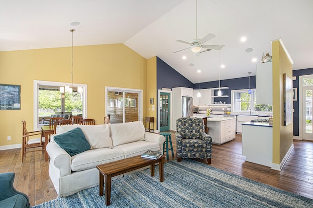 507 A Ave, South Haven, MI 49090 - living area with ceiling fan, dark wood-style floors, high vaulted ceiling, and baseboards