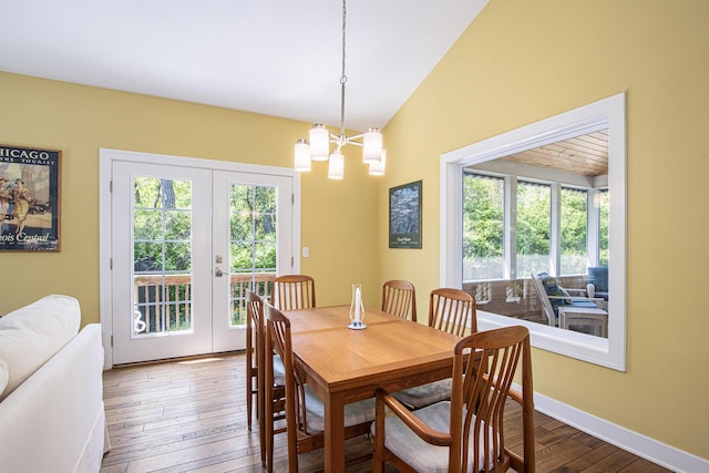 507 A Ave, South Haven, MI 49090 - dining area featuring a chandelier, french doors, hardwood / wood-style flooring, lofted ceiling, and baseboards