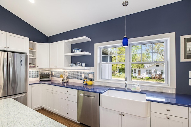 507 A Ave, South Haven, MI 49090 - kitchen featuring stainless steel appliances, open shelves, a sink, tasteful backsplash, and vaulted ceiling