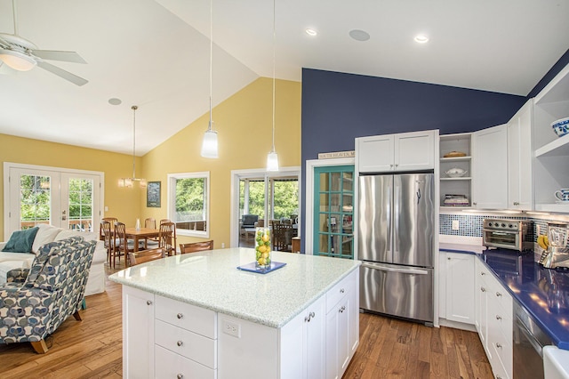 507 A Ave, South Haven, MI 49090 - kitchen featuring appliances with stainless steel finishes, open shelves, high vaulted ceiling, wood finished floors, and a ceiling fan