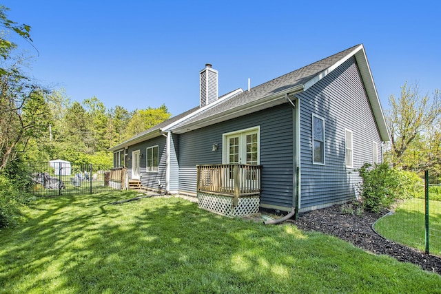 507 A Ave, South Haven, MI 49090 - back of house with a chimney, a wooden deck, and french doors
