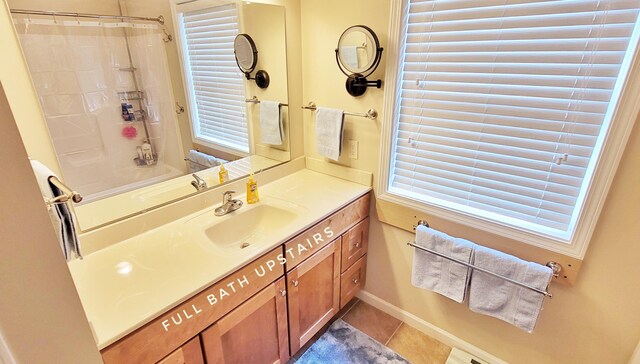 908 W Oak St, Bitely, MI 49309 - bathroom featuring tile patterned floors, curtained shower, and vanity