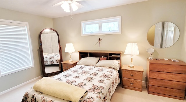908 W Oak St, Bitely, MI 49309 - bedroom with light carpet, baseboards, and a ceiling fan