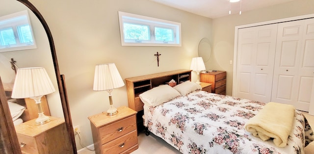 908 W Oak St, Bitely, MI 49309 - bedroom with multiple windows, a closet, arched walkways, and carpet flooring