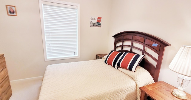 908 W Oak St, Bitely, MI 49309 - carpeted bedroom with baseboards