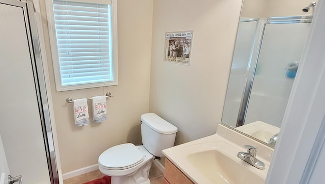 908 W Oak St, Bitely, MI 49309 - full bath featuring toilet, vanity, a shower with door, tile patterned flooring, and baseboards