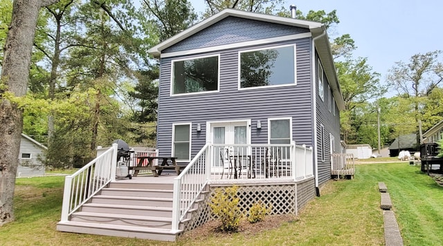 908 W Oak St, Bitely, MI 49309 - rear view of property with a wooden deck, a yard, and view of scattered trees