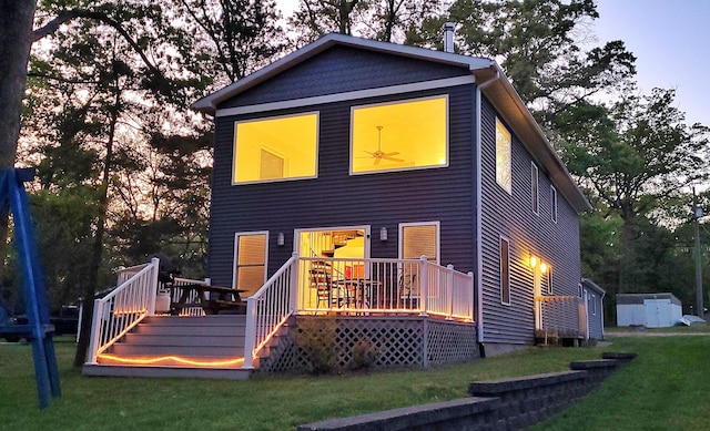 908 W Oak St, Bitely, MI 49309 - back of house with a deck and a lawn