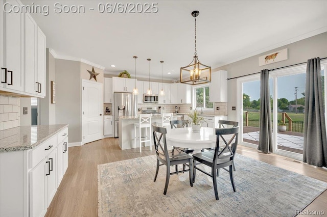 343 Hidden Riv E, Holly, MI 48442 - dining area with ornamental molding, light wood-type flooring, a chandelier, recessed lighting, and baseboards