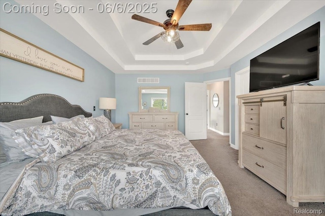 343 Hidden Riv E, Holly, MI 48442 - bedroom with carpet, a raised ceiling, baseboards, and ceiling fan