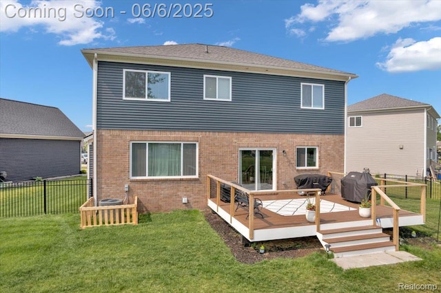 343 Hidden Riv E, Holly, MI 48442 - back of house featuring brick siding and a wooden deck