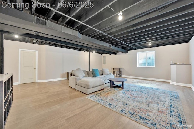 343 Hidden Riv E, Holly, MI 48442 - living room featuring wood finished floors and baseboards