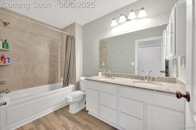 343 Hidden Riv E, Holly, MI 48442 - full bath with shower / bath combination with curtain, double vanity, toilet, and wood finished floors
