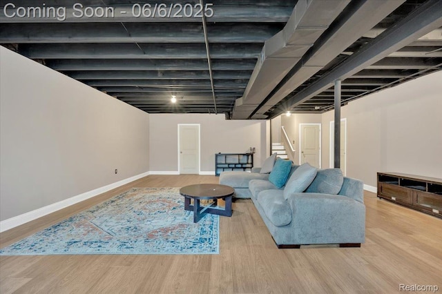 343 Hidden Riv E, Holly, MI 48442 - living room featuring wood finished floors, baseboards, and stairway