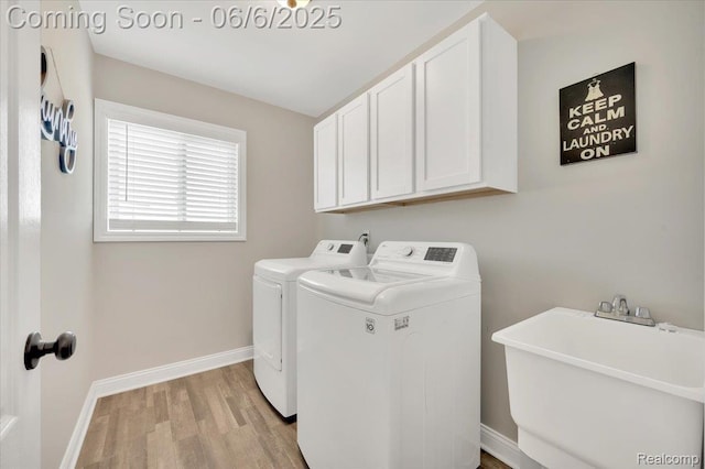 343 Hidden Riv E, Holly, MI 48442 - washroom with washing machine and dryer, light wood finished floors, cabinet space, and baseboards
