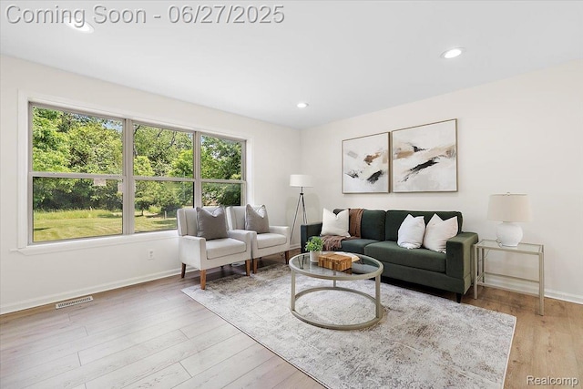 9248 Riverside Dr, Brighton, MI 48116 - living room featuring wood finished floors and recessed lighting