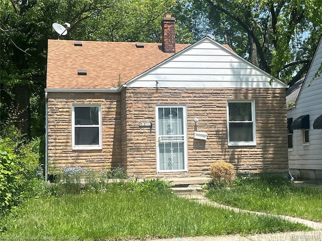 8810 Farmbrook St, Grosse Pointe, MI 48224 - back of property with a chimney and a shingled roof