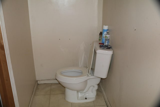 1223 Bemis St SE, Grand Rapids, MI 49506 - bathroom with toilet, tile patterned flooring, and baseboards