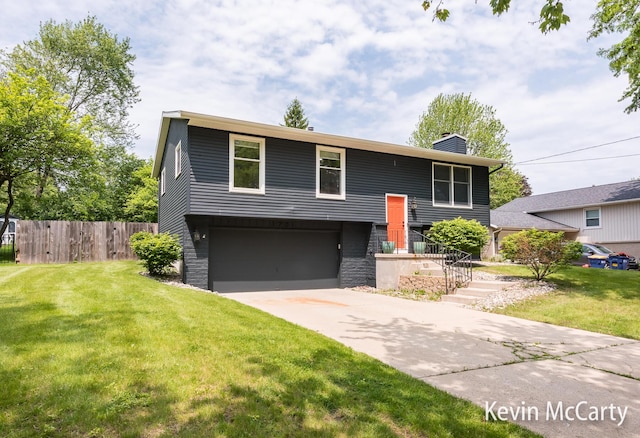 1731 Edgewood Ave SE, Grand Rapids, MI 49506 - bi-level home featuring a chimney, a garage, driveway, and stone siding