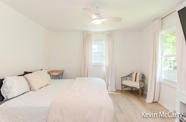 1731 Edgewood Ave SE, Grand Rapids, MI 49506 - bedroom with light wood-style flooring, a ceiling fan, and baseboards