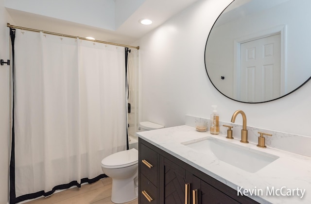 1731 Edgewood Ave SE, Grand Rapids, MI 49506 - bathroom with toilet, vanity, shower / bath combo, and recessed lighting