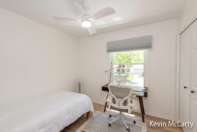 1731 Edgewood Ave SE, Grand Rapids, MI 49506 - bedroom with a closet, baseboards, a ceiling fan, and wood finished floors