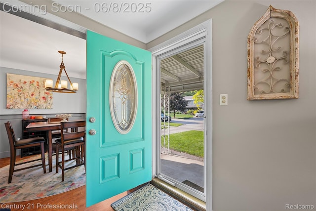 22601 Colony St, Saint Clair Shores, MI 48080 - foyer entrance with a chandelier and wood finished floors