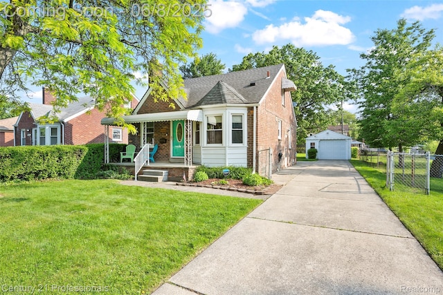 22601 Colony St, Saint Clair Shores, MI 48080 - view of front of home with a porch, brick siding, a detached garage, an outbuilding, and a shingled roof
