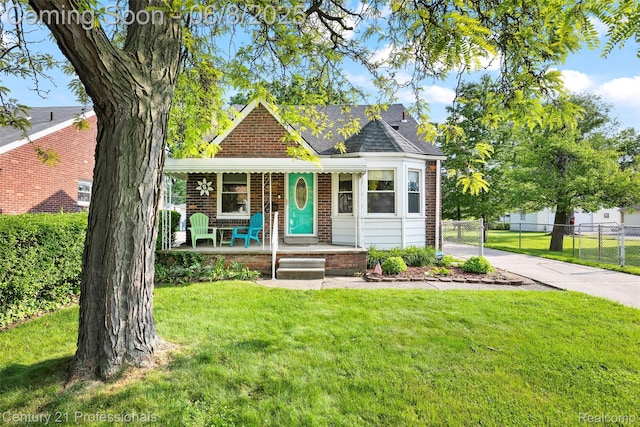 22601 Colony St, Saint Clair Shores, MI 48080 - view of front of home with brick siding, covered porch, concrete driveway, and a shingled roof
