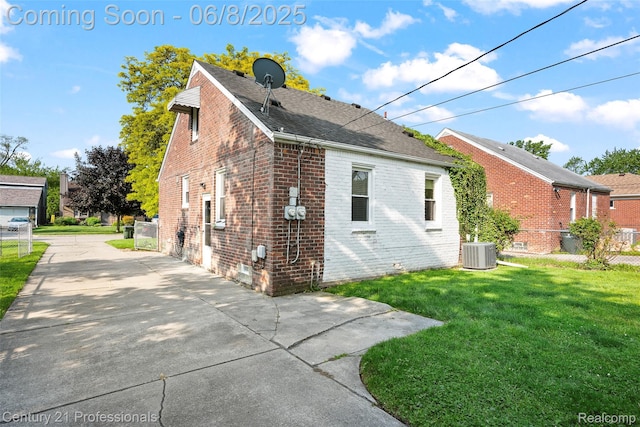 22601 Colony St, Saint Clair Shores, MI 48080 - view of property exterior featuring brick siding, central AC unit, and a shingled roof