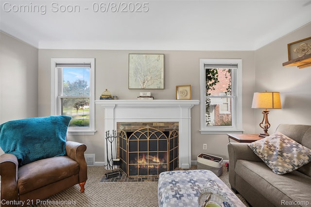 22601 Colony St, Saint Clair Shores, MI 48080 - living area with carpet, baseboards, and a fireplace with flush hearth