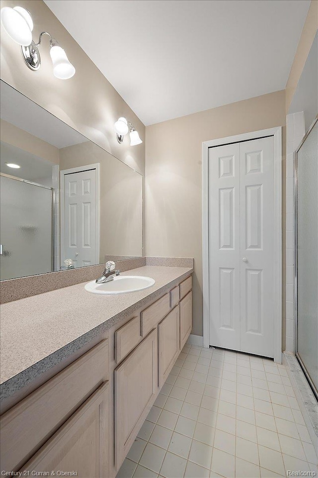 52179 Sawmill Creek Dr, Macomb, MI 48042 - full bath featuring tile patterned floors, vanity, and a shower stall
