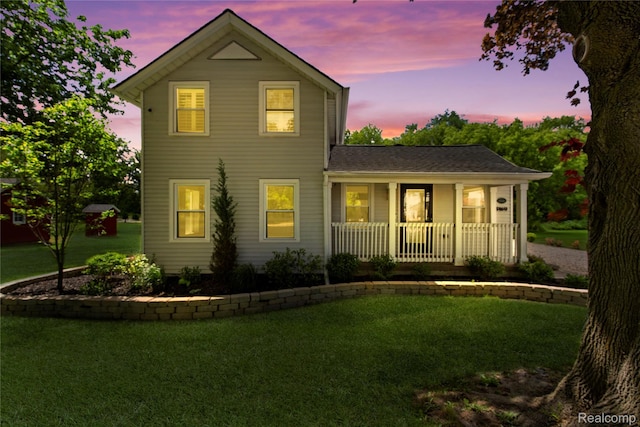 5164 Plymouth Rd, Ann Arbor, MI 48105 - view of front of home featuring covered porch and a yard