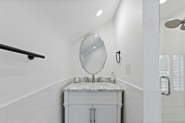 5164 Plymouth Rd, Ann Arbor, MI 48105 - bathroom featuring a shower stall, vanity, wainscoting, and tile walls