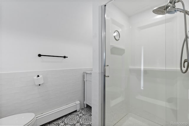 5164 Plymouth Rd, Ann Arbor, MI 48105 - full bath with baseboard heating, tile walls, a shower stall, a wainscoted wall, and tile patterned flooring