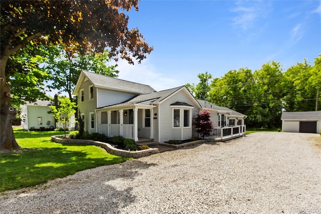 5164 Plymouth Rd, Ann Arbor, MI 48105 - view of front of property with a front yard, roof with shingles, and driveway