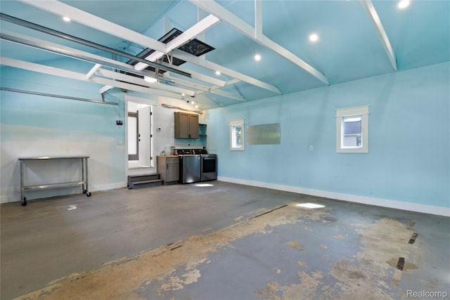 5164 Plymouth Rd, Ann Arbor, MI 48105 - garage featuring separate washer and dryer and recessed lighting