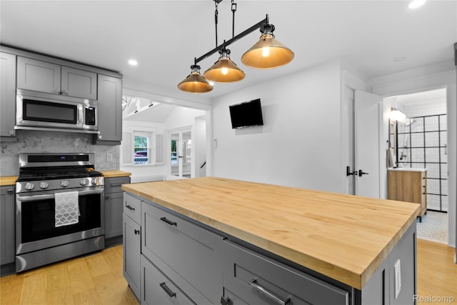 5164 Plymouth Rd, Ann Arbor, MI 48105 - kitchen with stainless steel appliances, butcher block countertops, gray cabinetry, light wood finished floors, and recessed lighting