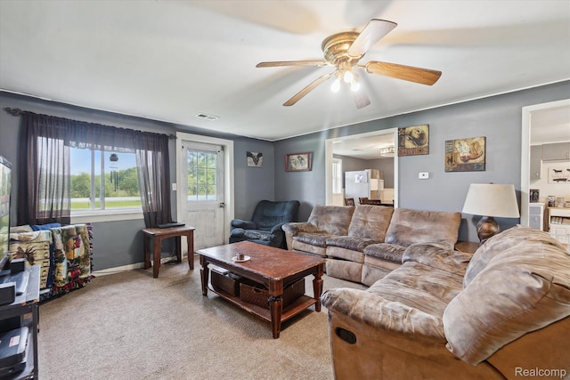 4828 Rathbun Rd, Birch Run, MI 48415 - living room with ceiling fan, light carpet, and baseboards
