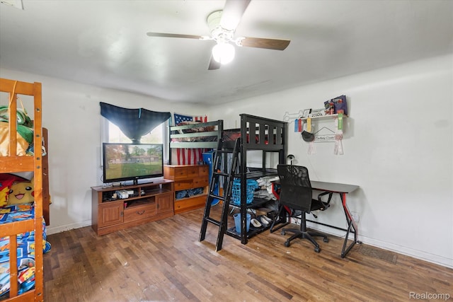 4828 Rathbun Rd, Birch Run, MI 48415 - bedroom featuring wood finished floors, baseboards, and a ceiling fan