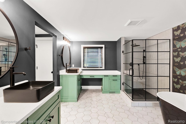 5080 Tootmoor Rd, Bloomfield Hills, MI 48302 - full bath featuring a stall shower, two vanities, a soaking tub, and baseboards