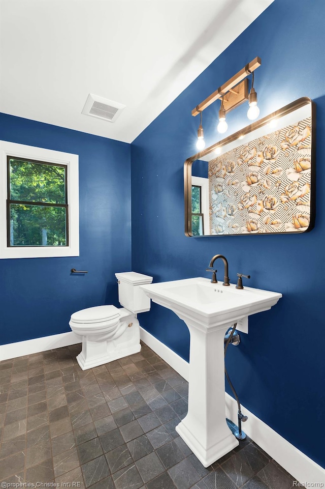 5080 Tootmoor Rd, Bloomfield Hills, MI 48302 - half bathroom with baseboards and toilet