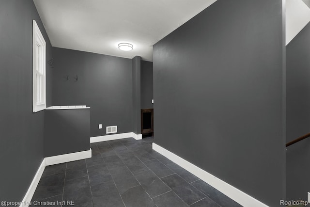 5080 Tootmoor Rd, Bloomfield Hills, MI 48302 - unfurnished room featuring baseboards and dark tile patterned floors