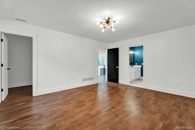 5080 Tootmoor Rd, Bloomfield Hills, MI 48302 - spare room featuring a chandelier, wood finished floors, and baseboards
