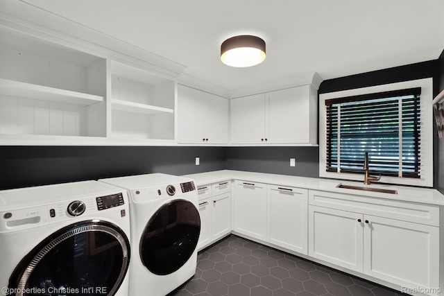 5080 Tootmoor Rd, Bloomfield Hills, MI 48302 - laundry area featuring washer and dryer, cabinet space, and dark tile patterned flooring