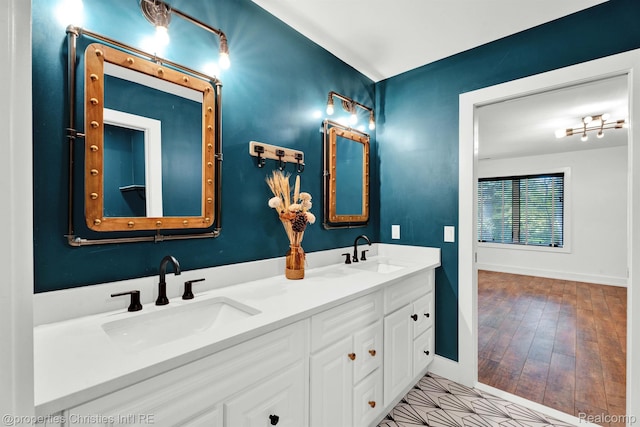 5080 Tootmoor Rd, Bloomfield Hills, MI 48302 - bathroom featuring baseboards and double vanity