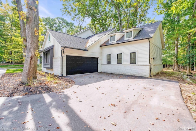 5080 Tootmoor Rd, Bloomfield Hills, MI 48302 - modern farmhouse style home with driveway, brick siding, a garage, and board and batten siding