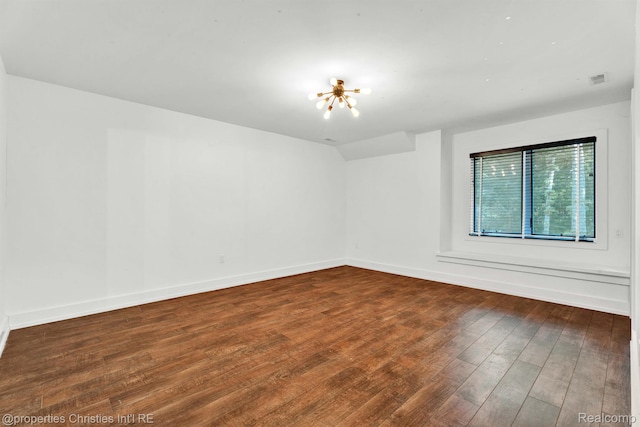 5080 Tootmoor Rd, Bloomfield Hills, MI 48302 - empty room with wood finished floors, baseboards, and a chandelier
