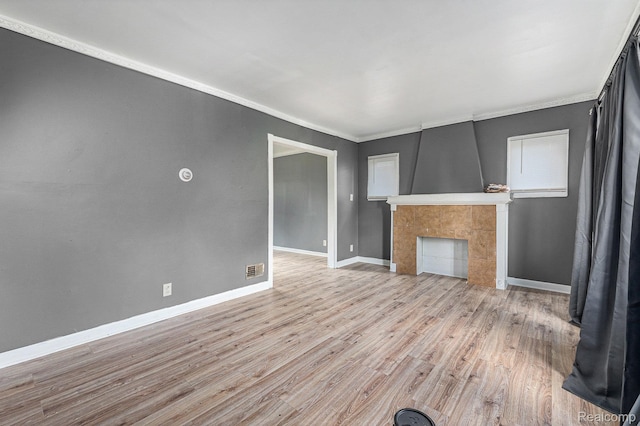15817 Cheyenne St, Detroit, MI 48227 - unfurnished living room featuring light wood finished floors, baseboards, a fireplace, and ornamental molding